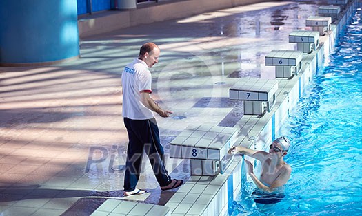group of happy kids children at swimming pool class learning to swim group of happy kids children at swimming pool class learning to swim