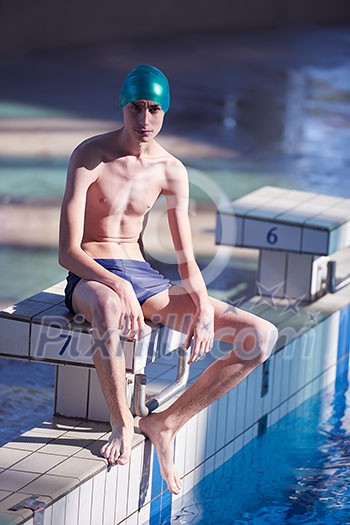 swimmer excercise on indoor swimming pool, sport and health concept