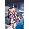 swimmer excercise on indoor swimming pool, sport and health concept