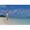 happy young woman on summer vacation on beautiful tropical beach have fun and relax