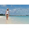 happy young woman on summer vacation on beautiful tropical beach have fun enjoy and relax
