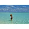 happy young woman on summer vacation on beautiful tropical beach have fun enjoy and relax