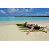 happy young woman on summer vacation on beautiful tropical beach have fun enjoy and relax