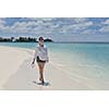 happy young woman on summer vacation on beautiful tropical beach have fun enjoy and relax