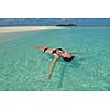 happy young woman on summer vacation on beautiful tropical beach have fun enjoy and relax