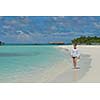 happy young woman on summer vacation on beautiful tropical beach have fun enjoy and relax