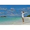 happy young woman on summer vacation on beautiful tropical beach have fun enjoy and relax