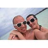 happy young  couple at summer vacation have fun and relax at beautiful sunny  day on beach