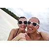 happy young couple have fun and relax at summer vacation on background maldives travel location and beautiful white sand beach