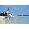 happy young woman on summer vacation on beautiful tropical beach have fun enjoy and relax