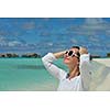 happy young woman on summer vacation on beautiful tropical beach have fun enjoy and relax