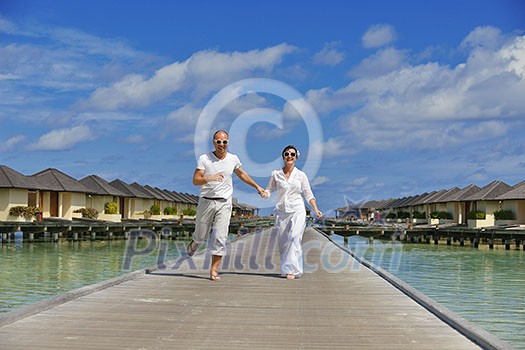happy young couple at summer vacation have fun and relax at beautiful sunny day on beach happy young couple at summer vacation have fun and relax at beautiful sunny day on beach
