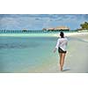 happy young woman on summer vacation on beautiful tropical beach have fun enjoy and relax