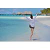 happy young woman on summer vacation on beautiful tropical beach have fun and relax