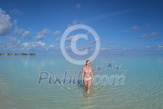 happy young woman on summer vacation on beautiful tropical beach have fun enjoy and relax happy young woman on summer vacation on beautiful tropical beach have fun enjoy and relax