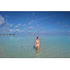 happy young woman on summer vacation on beautiful tropical beach have fun enjoy and relax