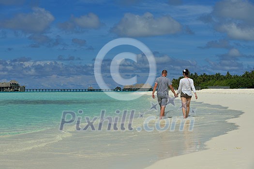 happy young romantic couple in love have fun running and relaxing on beautiful beach happy young romantic couple in love have fun running and relaxing on beautiful beach
