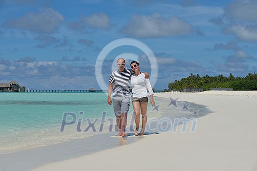 happy young couple at summer vacation have fun and relax at beautiful sunny day on beach happy young couple at summer vacation have fun and relax at beautiful sunny day on beach