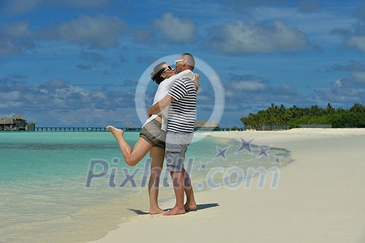 happy young romantic couple in love have fun running and relaxing on beautiful beach