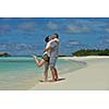 happy young romantic couple in love have fun running and relaxing on beautiful beach