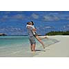happy young romantic couple in love have fun running and relaxing on beautiful beach