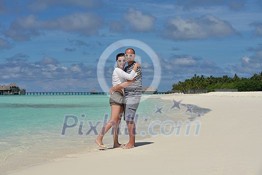 happy young couple at summer vacation have fun and relax at beautiful sunny day on beach happy young couple at summer vacation have fun and relax at beautiful sunny day on beach