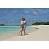 happy young  couple at summer vacation have fun and relax at beautiful sunny  day on beach
