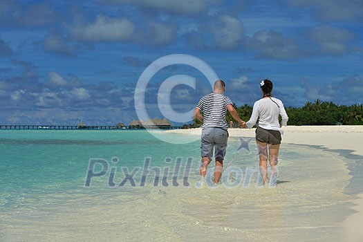 happy young romantic couple in love have fun running and relaxing on beautiful beach happy young romantic couple in love have fun running and relaxing on beautiful beach