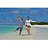 happy young romantic couple in love have fun running and relaxing on beautiful beach