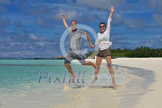 happy young romantic couple in love have fun running and relaxing on beautiful beach happy young romantic couple in love have fun running and relaxing on beautiful beach