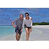 happy young  couple at summer vacation have fun and relax at beautiful sunny  day on beach