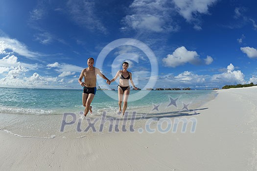 happy young couple have fun and relax at summer vacation on background maldives travel location and beautiful white sand beach happy young couple have fun and relax at summer vacation on background maldives travel location and beautiful white sand beach
