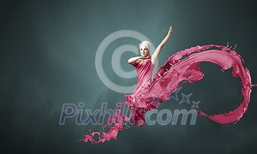 Young attractive woman in pink dress jumping high Young attractive woman in pink dress jumping high