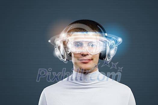 Young handsome man against media backdrop wearing headphones Young handsome man against media backdrop wearing headphones