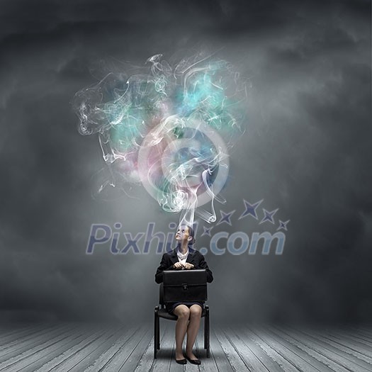 Young thoughtful confused businesswoman sitting on chair Young thoughtful confused businesswoman sitting on chair