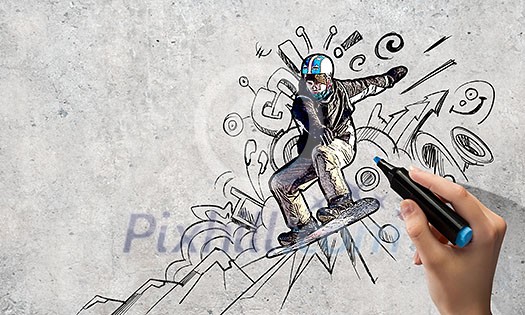 Close up of hand drawing sketches of snowboarder Close up of hand drawing sketches of snowboarder