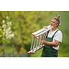 Senior man gardening in his garden (color toned image)