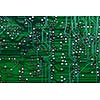 Printed green computer circuit board with many electrical components