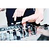 dj equipment gramophone and mixete with dj hand on party event
