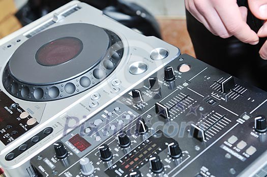 dj equipment gramophone and mixete with dj hand on party event dj equipment gramophone and mixete with dj hand on party event