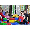 happy child kids group have fun and play at kindergarden indoor preschool education concept with  teacher