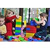 happy child kids group have fun and play at kindergarden indoor preschool education concept with  teacher