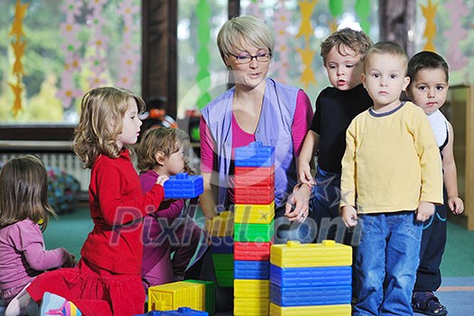 happy child kids group have fun and play at kindergarden indoor preschool education concept with teacher happy child kids group have fun and play at kindergarden indoor preschool education concept with teacher