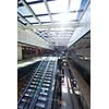 modern shopping mall store  interior escalator with lens flare