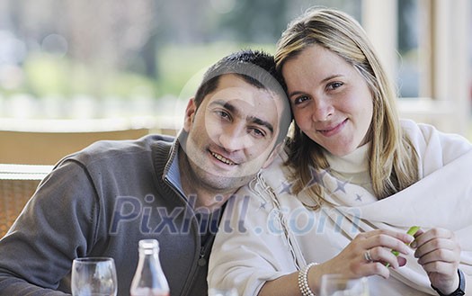 young happy couple have fun on coffee break at bright morning young happy couple have fun on coffee break at bright morning