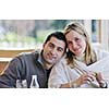 young happy couple have fun on coffee break at bright morning