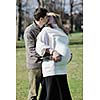 happy young married family couple outdoor in nature have fun and waiting baby and representing young family growth and pregnancy concept