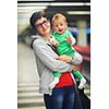 young mother with baby in shopping mall supermarket store buying food and grocery
