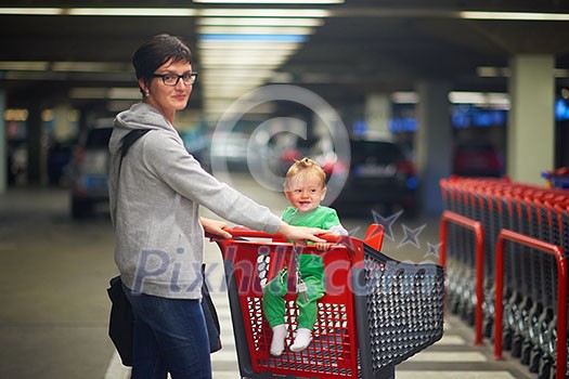 young mother with baby in shopping mall supermarket store buying food and grocery young mother with baby in shopping mall supermarket store buying food and grocery