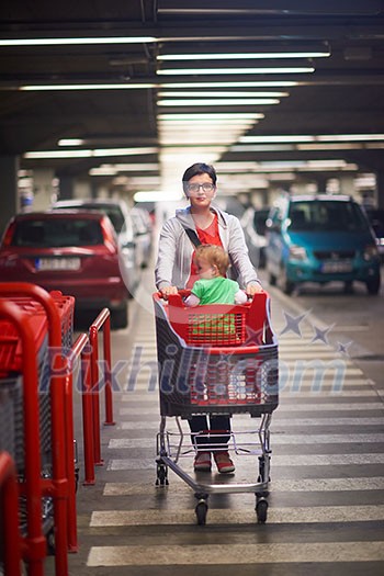 young mother with baby in shopping mall supermarket store buying food and grocery young mother with baby in shopping mall supermarket store buying food and grocery